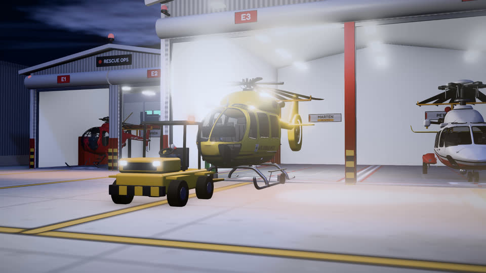 A yellow tug tows a helicopter out of its bay in the Emergency hangar at night